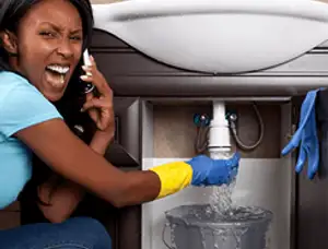 Emergency plumbing repair for a leaking sink drain under a bathroom vanity in Saint Charles, MO