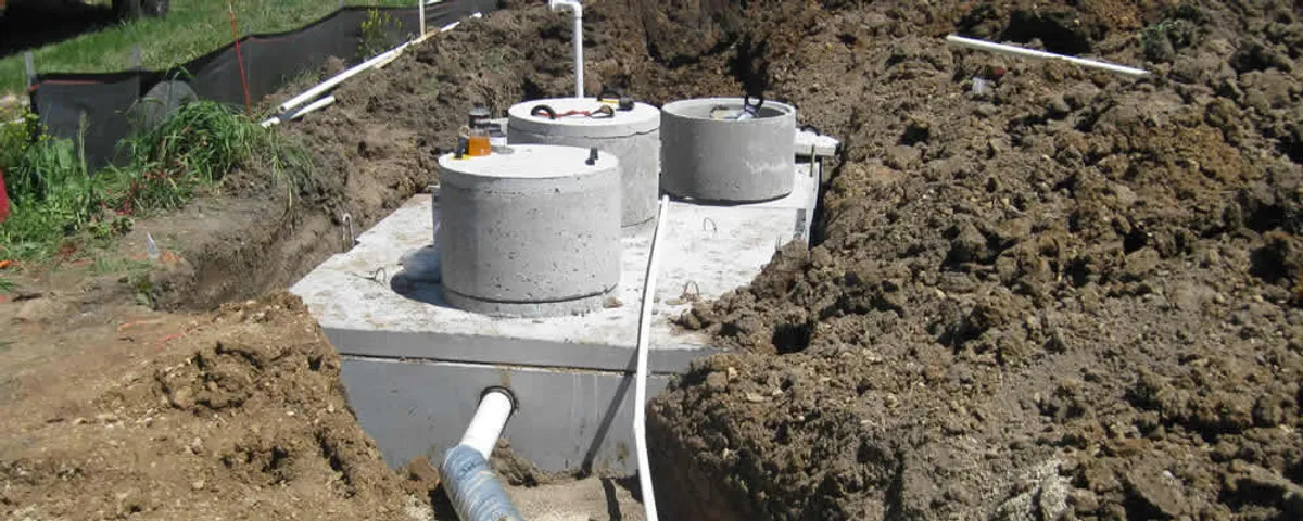 Septic system repair and installation site with tank access ports in Saint Charles, MO