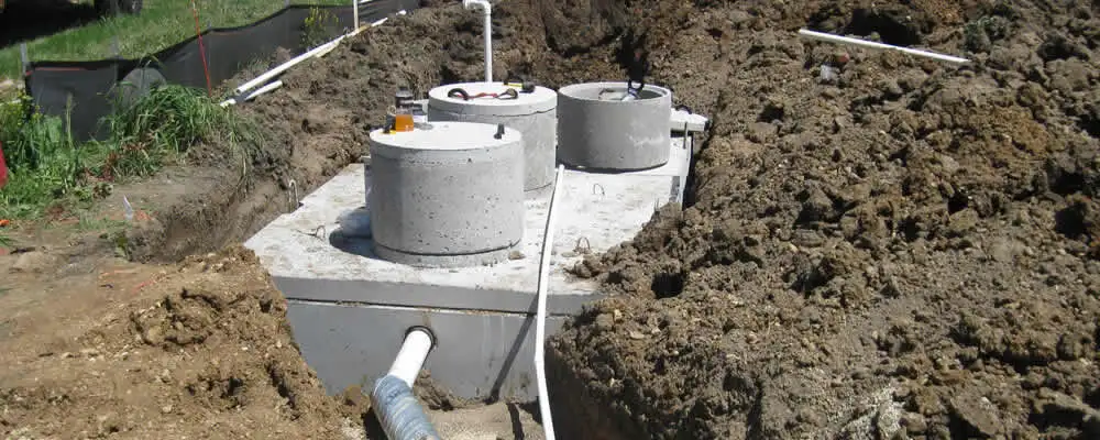Septic system repair and installation site with tank access ports in Saint Charles, MO